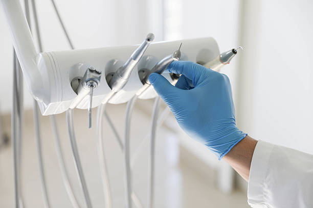 Professional Tooth Extraction technician working in Worcester, MA